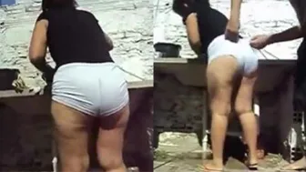 Dona de casa rabuda lavando roupa no quintal